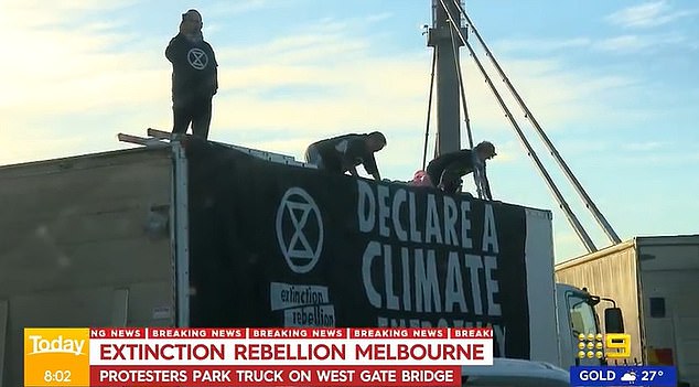 Climate change activists Extinction Rebellion parked a rented truck across three lanes of the Westgate Bridge leading into Melbourne.