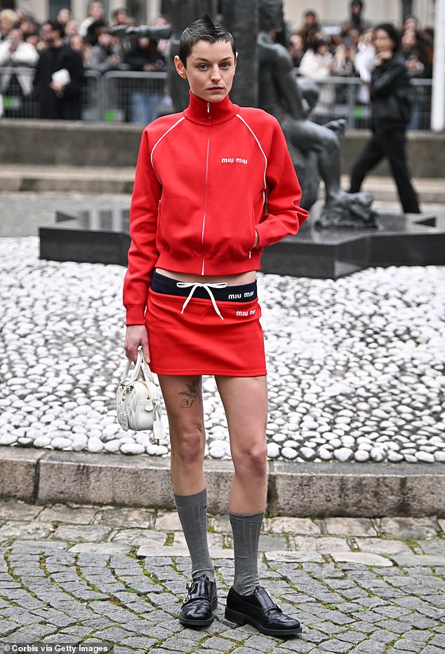 The Crown star Emma turned heads in a red trainer and matching skirt.