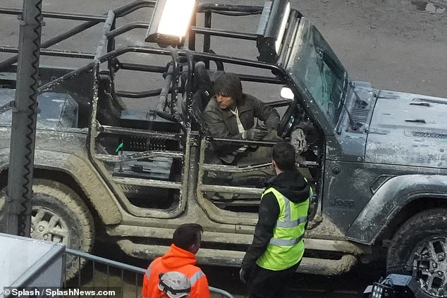Filming new scenes, Tom wore a black leather jacket as he took control of a rickety open van.