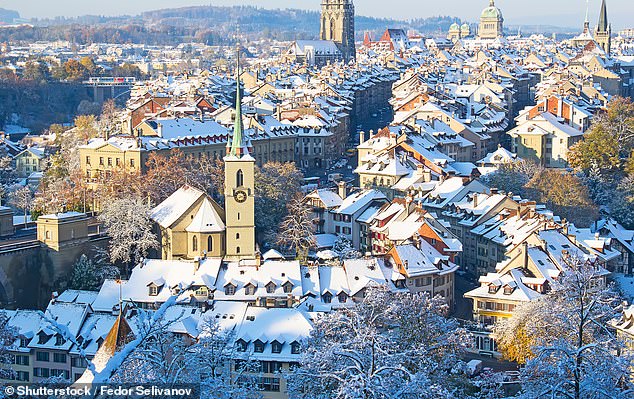 Fly to Geneva and explore Switzerland by train, stopping in Lausanne, Freiburg, Bern (pictured) and Neuchatel.