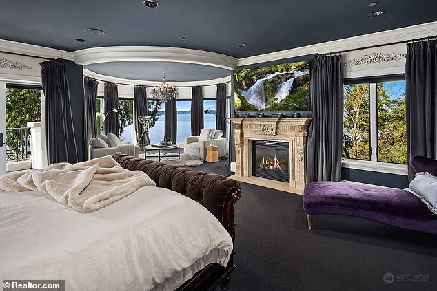 The master bedroom is huge with its own sitting area and views of the lake.