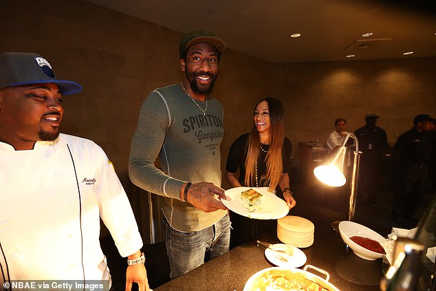 Hardy (left) a decade ago in New York City hosted an event hosted by then-New York Knicks player Amar'e Stoudemire (center)