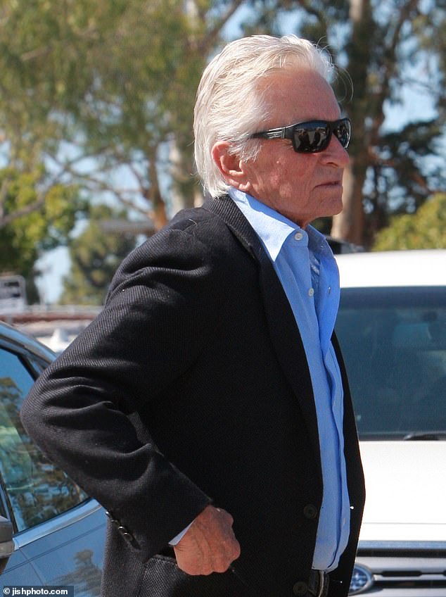 The Oscar winner, 79, looked dapper in a navy suit, black shoes and dark sunglasses.