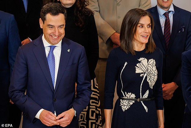 The royal was photographed smiling next to the Andalusian president Juanma Moreno