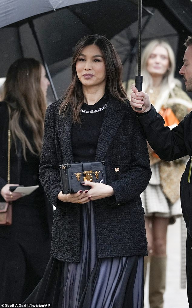 Gemma Chan put on a sophisticated show in a navy silk skirt and dark tweed blazer.