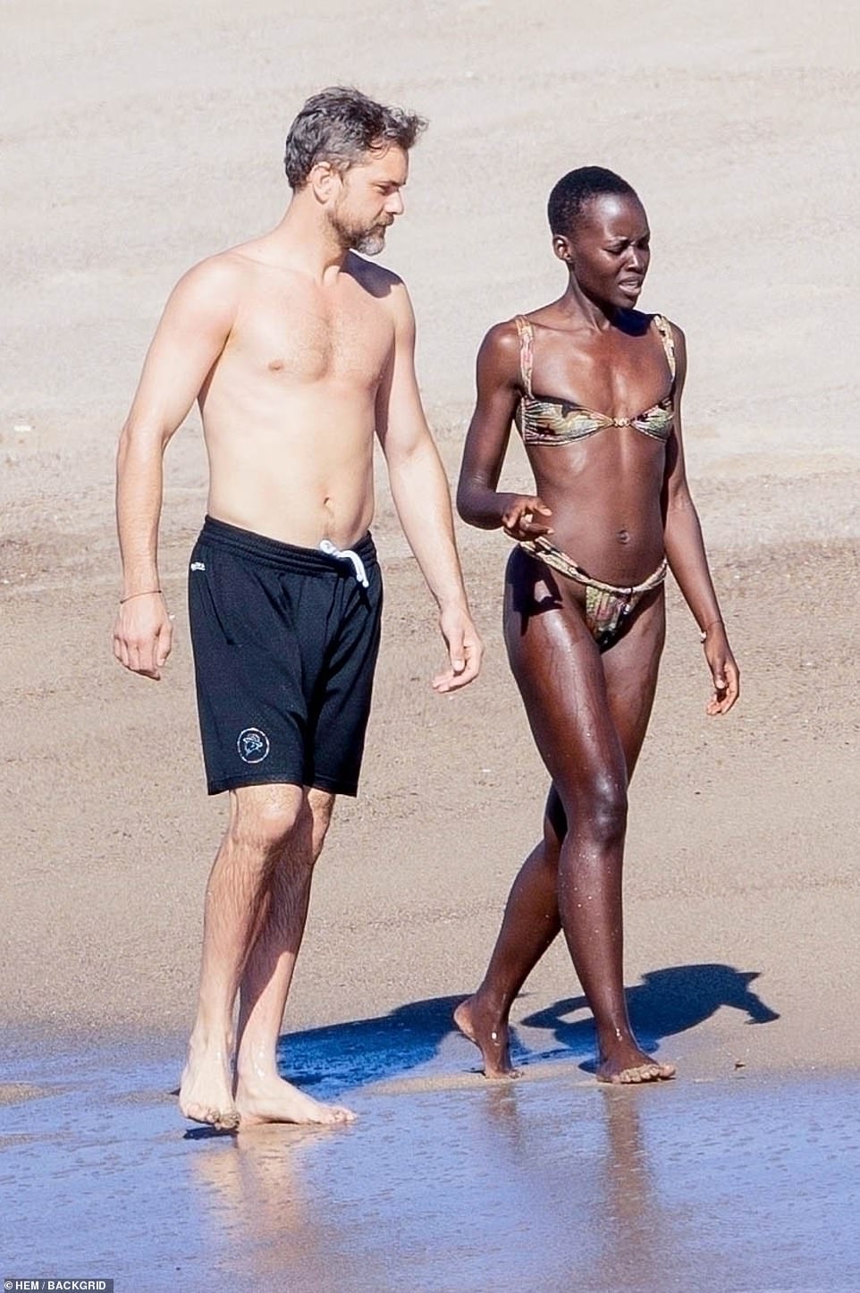 Lupita was dressed in a skimpy printed thong bikini, showing off her slim and fit figure.
