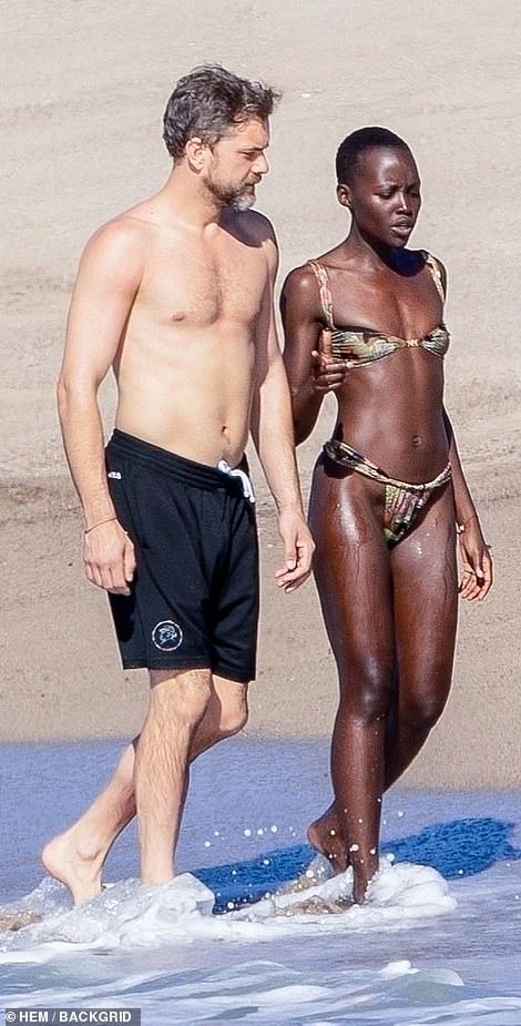 Lupita's complexion glowed after the couple ventured into the ocean.