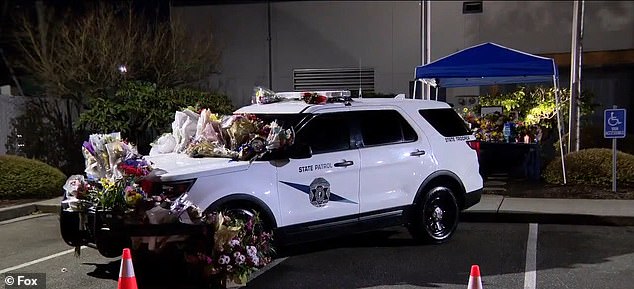A patrol car was also covered in flowers in his honor and an online memorial page has been created to donate to his family.