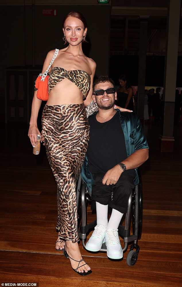 Chantelle, 32, embraced her wild side in a daring leopard print bra, which showed off her slender figure, teamed with a matching skirt. Meanwhile, Dylan, 33, looked every inch the rock star in an unbuttoned turquoise shirt, black T-shirt and matching pants.