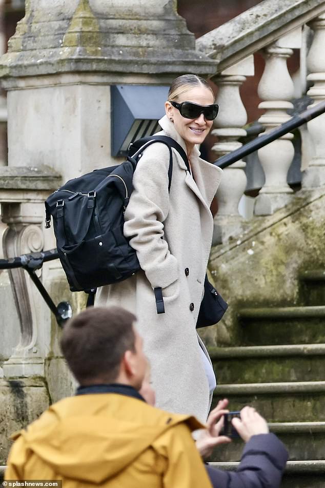Enjoying some time off, she wore a stylish cream wool coat with a pair of light wash jeans and heeled boots.