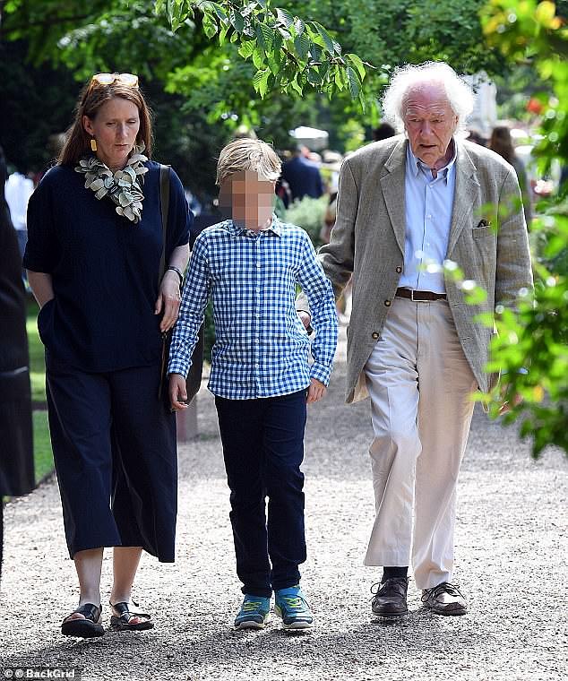 Michael has three children in total. He shares his children Tom and Will with his girlfriend Philippa (left to right: Philippa, Tom and Michael)