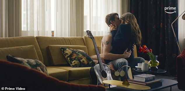 Here they kiss like teenagers on a couch next to their guitar