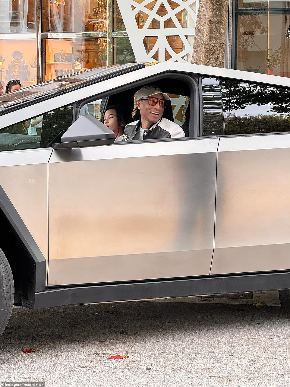 'Pharrellel parking' - Pharrell Williams gave up and parked on the street after trying unsuccessfully to parallel park in front of a Louis Vuitton store in Miami, Florida.