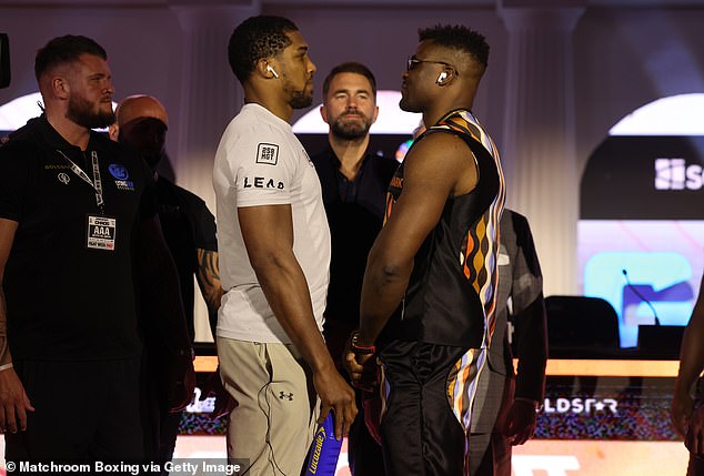 Joshua (left) and Ngannou (right) will face off inside the boxing ring in Riyadh on Friday night.