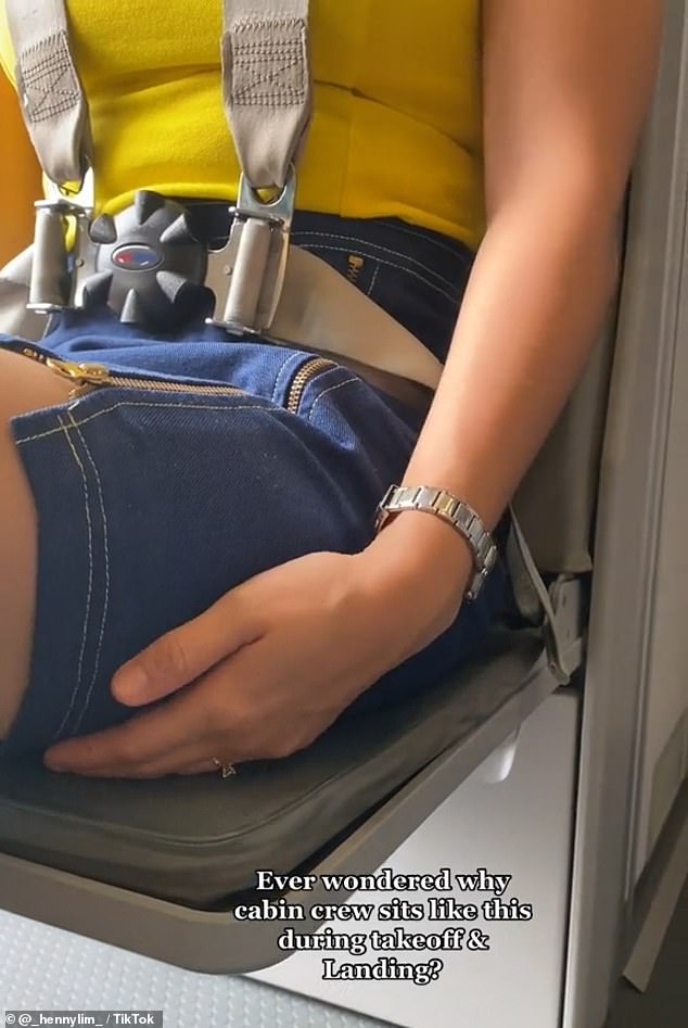 He took to TikTok to explain why passengers saw flight attendants put their hands under their thighs while they were buckled into their jump seats during landings.