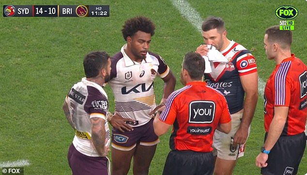 Mom (second from left) is pictured making the racial abuse claim during her team's loss to the Roosters in Las Vegas last Sunday.