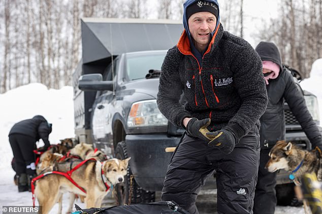Seavey watches during the official restart of the 52nd Iditarod Trail Sled Dog Race in Willow