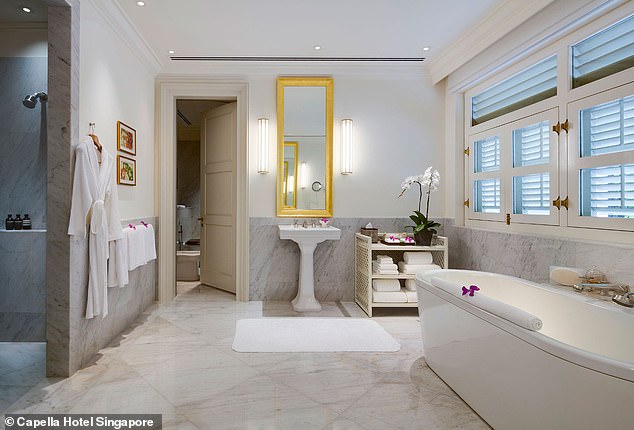 The mansion's bathrooms feature marble floors and walls.