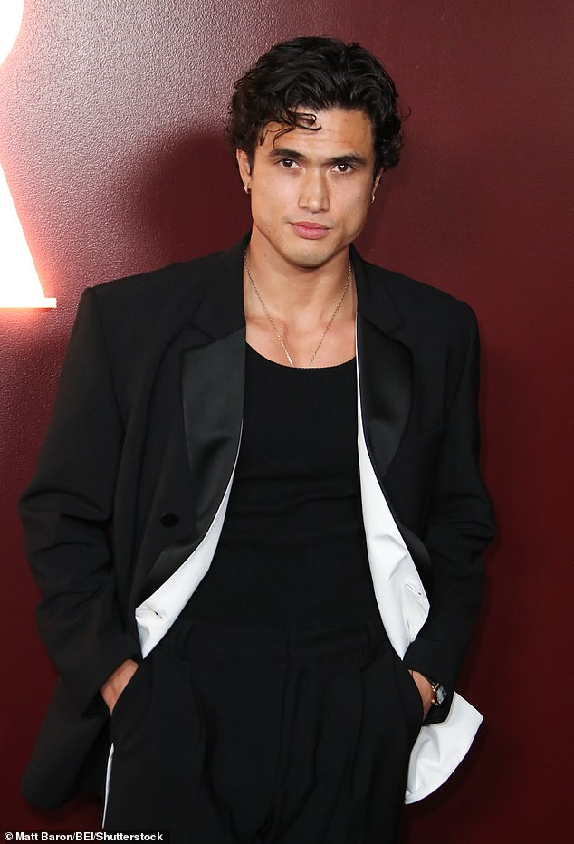May December star Charles Melton sizzled in a tight black shirt under a tuxedo jacket