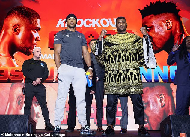 Joshua and Ngannou (right) will meet in a money-spinning heavyweight fight in Saudi Arabia.