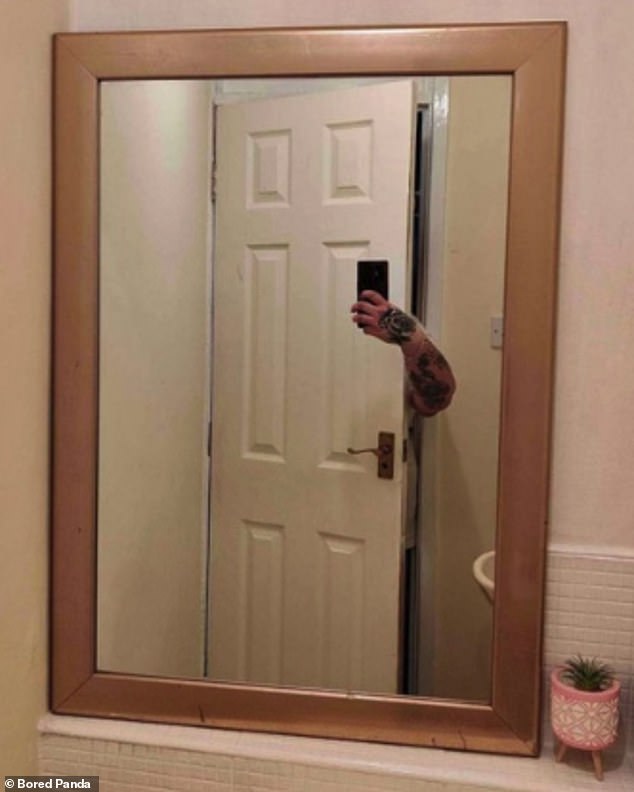 In another not-quite-perfect attempt, a selfie-taker hid behind his door, with a tattooed arm revealing he was there.