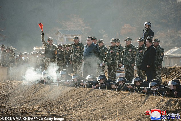 1709809340 478 Kim Jong GUN Leather clad North Korean dictator brandishes assault rifle as