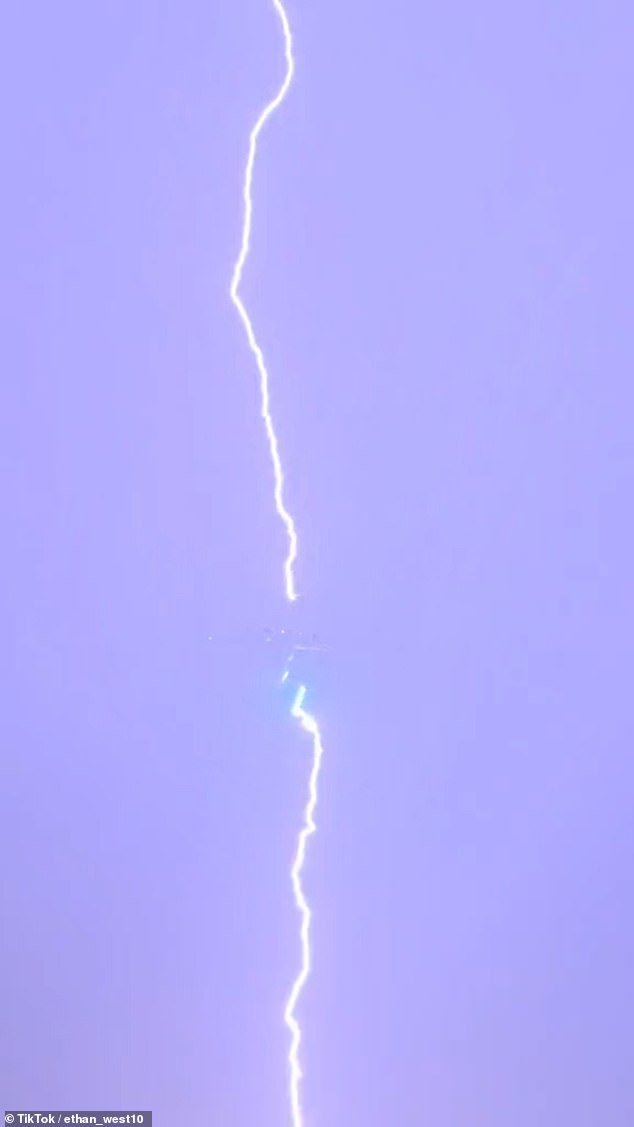 The lightning was so bright that you could barely see the plane in the middle of the lightning.