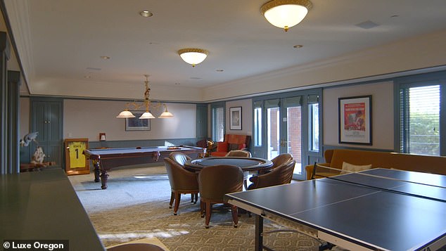 The lower level game room has a full bar with refrigerator, sink, stove and dishwasher.