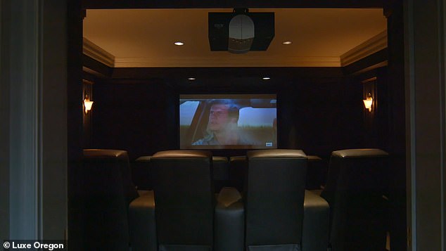 There are eight home theater seats in front of the projector screen.