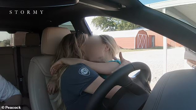 Stormy is seen hugging her young daughter in the trailer for the documentary