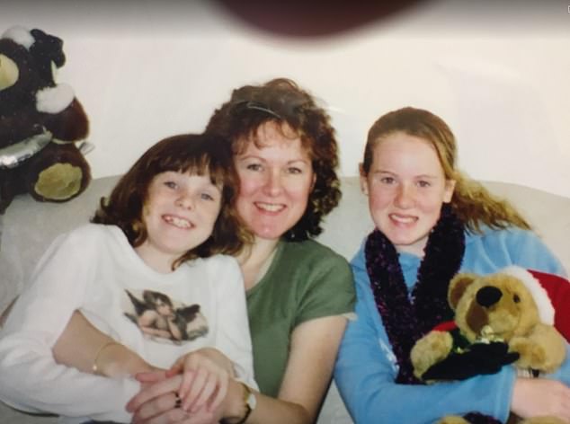 Mrs Holyoak, pictured above with her two daughters, Haley (left) and Michelle, is separated from her family and lives alone in social housing.