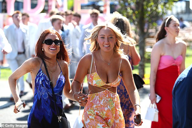 Property data group CoreLogic found that 68.2 per cent of women across all age groups owned at least one property compared to 67.4 per cent of men (pictured, women at Royal Racecourse Randwick (Sydney).