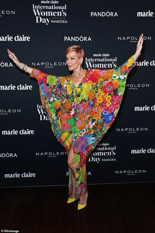 Jessica Rowe put on a colorful show in a floral dress with a high slit and sleeves.