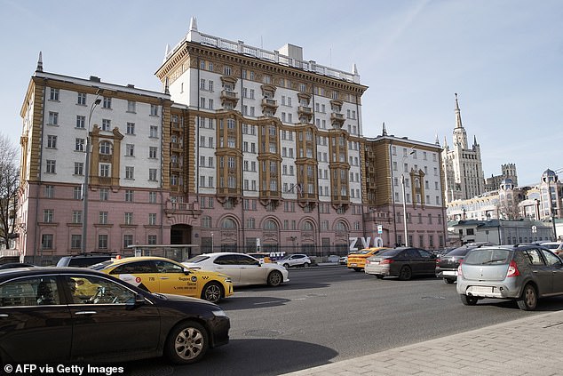 Cars pass by the US embassy building in Moscow on March 7, 2024.