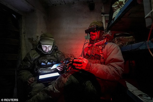 Ukrainian drone operators (pictured) have been using cheap commercial drones with explosive devices to hunt Russian tanks and bunkers.