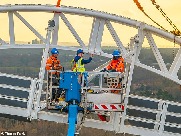 A 500-ton crane helped lift the 92nd and final piece of track into place to complete the 995.4 m (3,265 ft) long run, which reaches a height of 236 ft (71 m) and speeds of more than 80 mph (128 km/h).