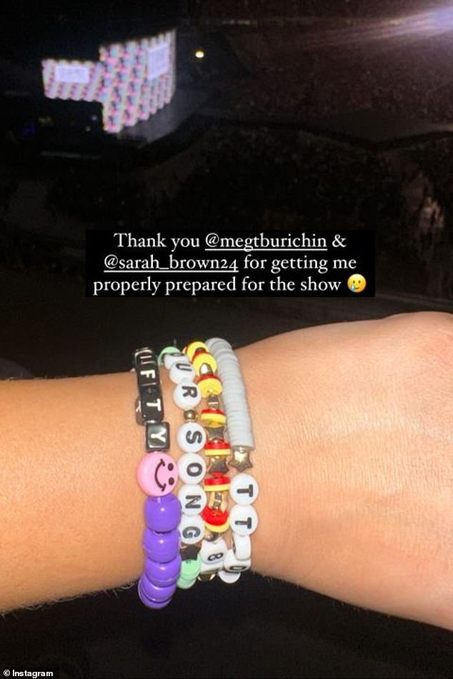 Amanda Santa, the wife of Travis' manager Aaron Eanes, also shared a photo of her Swiftie friendship bracelets, while the stage could be seen in the background.