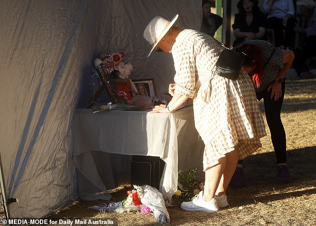 Many who gathered did not know the family but felt compelled to pay their respects.