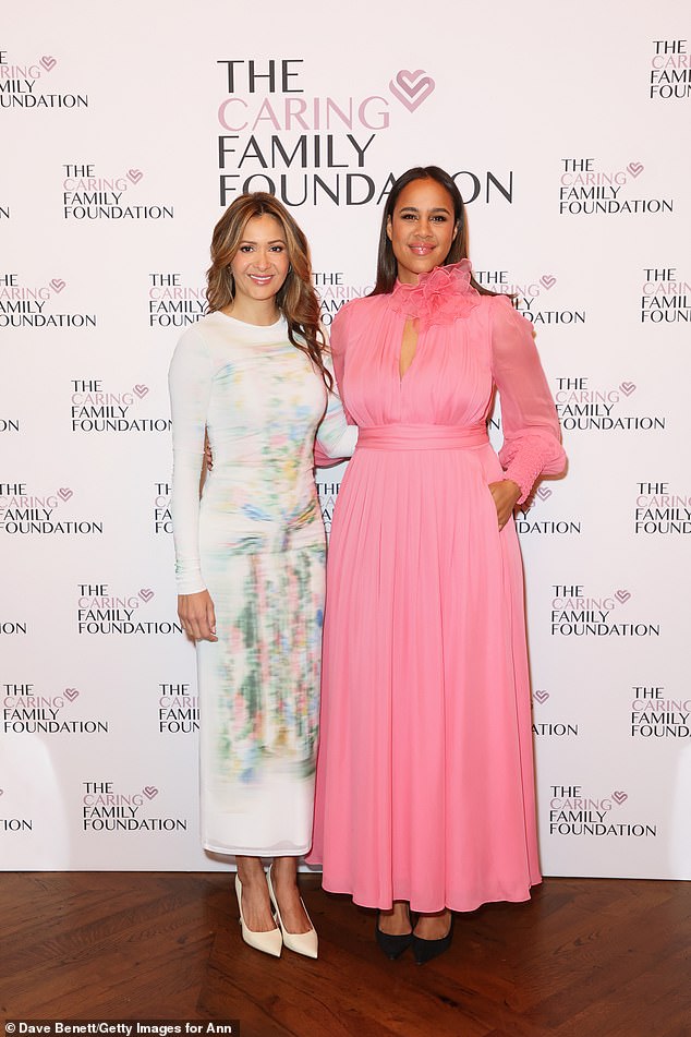 She paired her stunning dress with a simple pair of black pointed-toe stilettos (pictured with Patricia Caring).