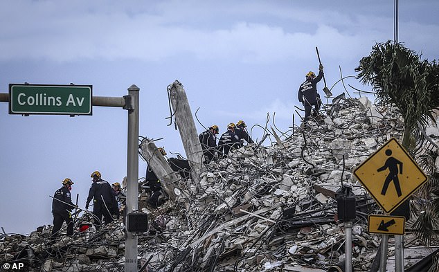 Workers continued searching for survivors at the site on July 5, 2021, a day after the remaining portion of the structure was demolished to aid search efforts.
