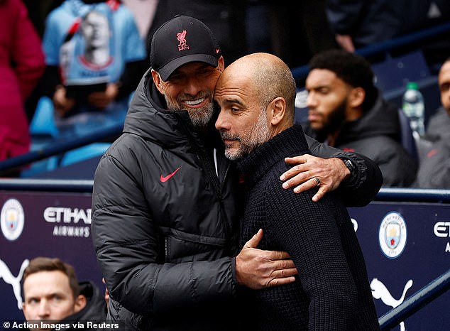 Liverpool manager Jurgen Klopp (left) with Manchester City manager Pep Guardiola.