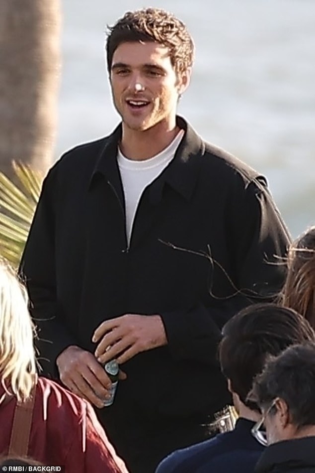 Jacob, 26, whose film Saltburn was produced by Margot's production company, was wearing a white shirt, black jacket and trousers.