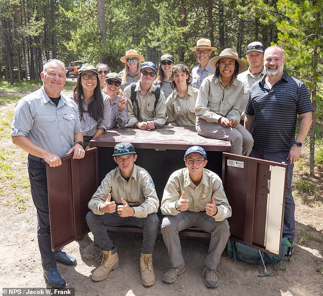 Yellowstone staff are seen smiling for the camera. During peak tourist season, the park employs more than 3,000 people.