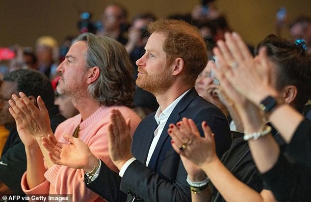 Prince Harry sat in the front row to support his wife Meghan as she spoke on the panel.