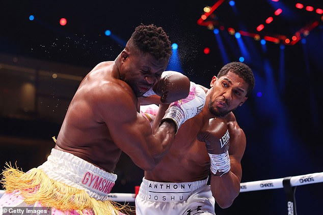 Joshua lands a knockout right hand that sent Ngannou to the ground in the second round.