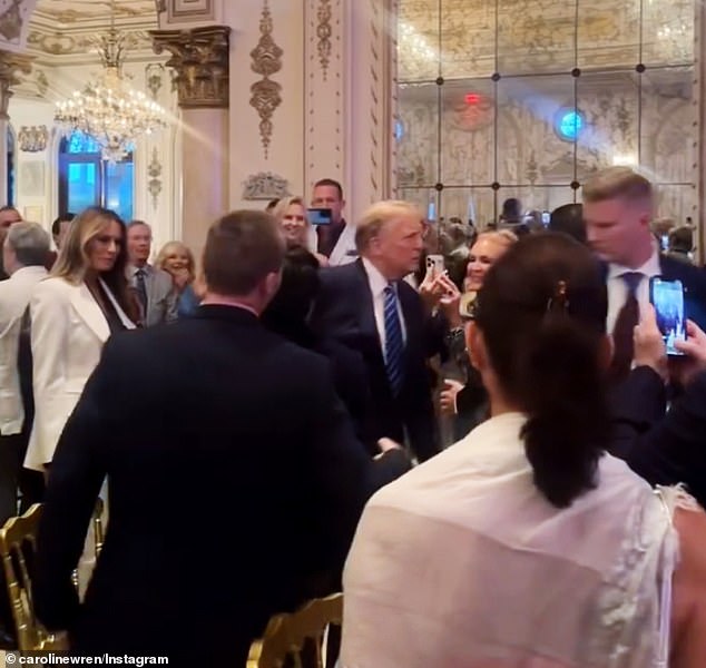 The couple entered to cheers and applause as they walked through the Mar-a-Lago ballroom.