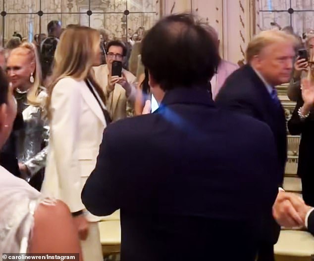 Those present took out their phones to take a photo of the couple. Trump can be seen shaking hands with his supporters