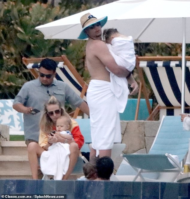 He and his wife Brittany attended to their children Sterling and Bronze poolside in Los Cabos.
