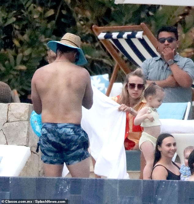 Brittany could be seen wrapping a towel around Sterling near the pool during the trip.