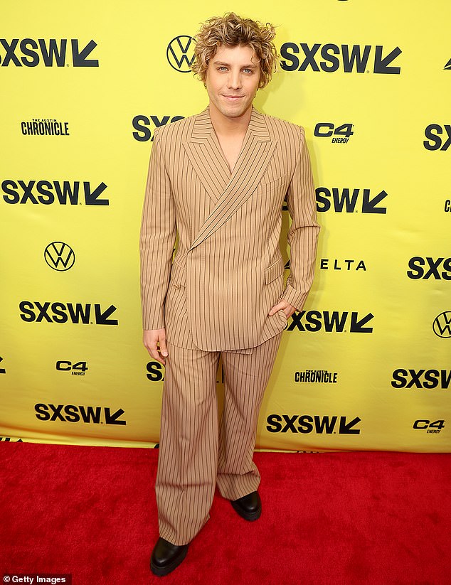Lukas Gage rocked a beige striped jacket and a pair of matching oversized pants at the film's premiere.